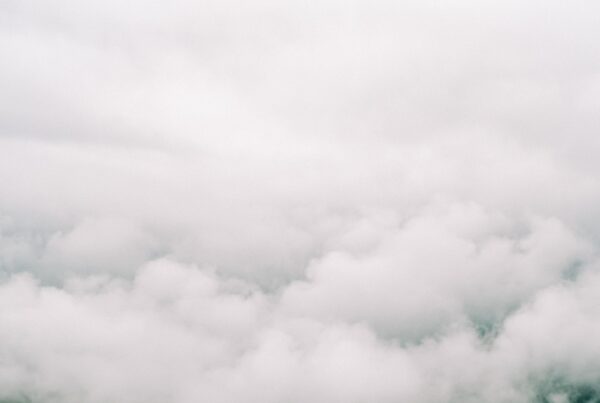 Clouds towering above a forest.